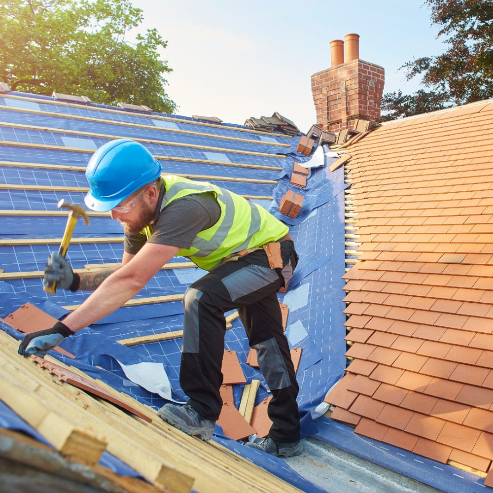 Roof tarp service during storm damage restoration